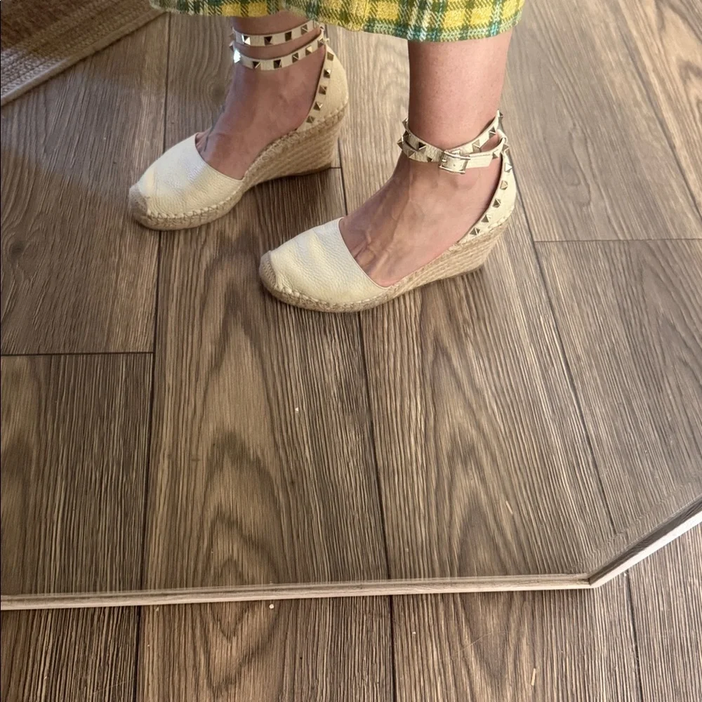 These are Valentino Garavani Rockstud textured-leather espadrille wedge heel